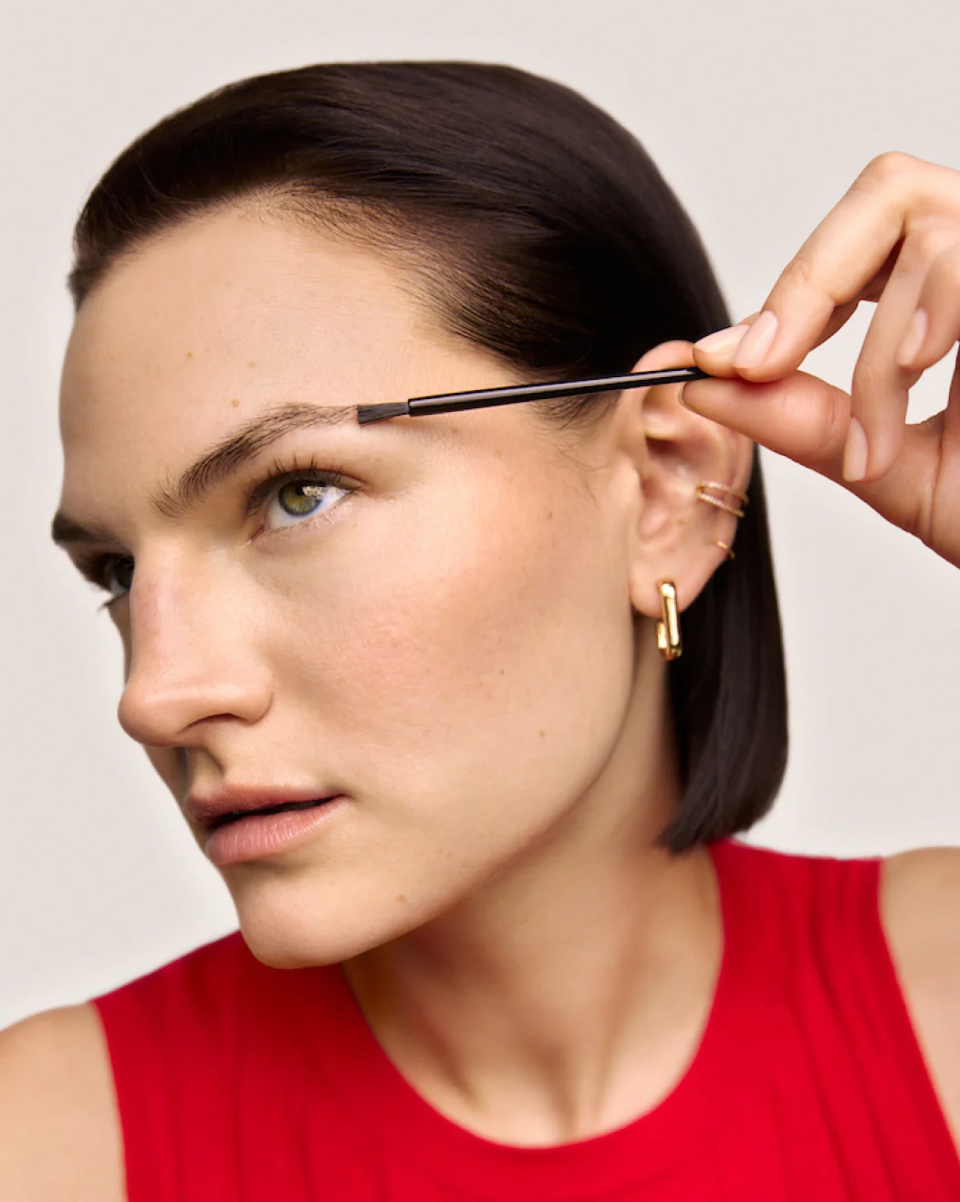 woman using Latisse on her eyebrows