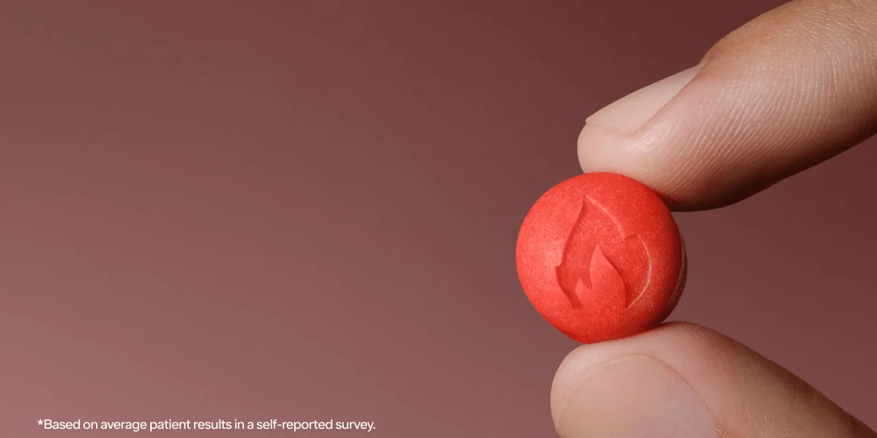 a Ro Sparks sublingual drop held between two fingers