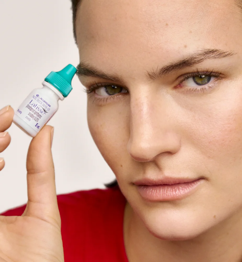 woman holding Latisse