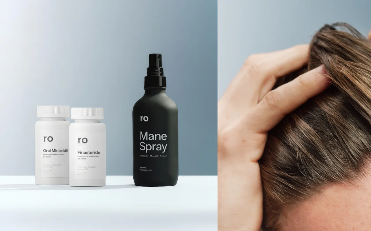 Man waking up in bed and touching his hair with Ro hair-loss product